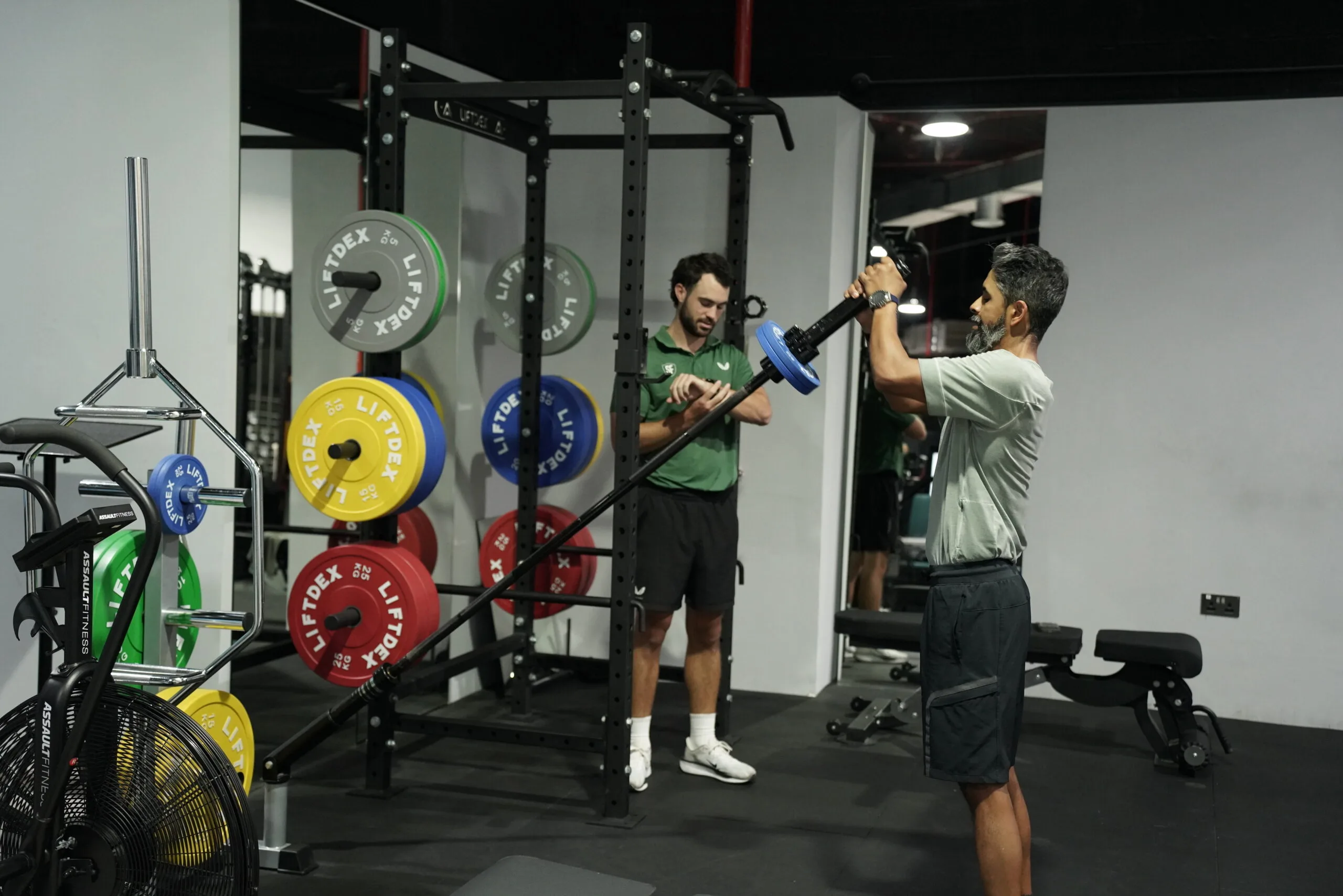 golfer doing golf fitness workout with trainer in Dubai